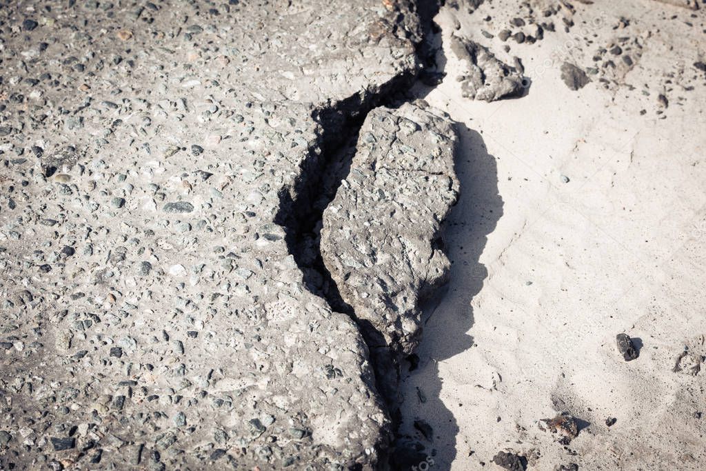 The crack of collapsed asphalt from improper laying workers road