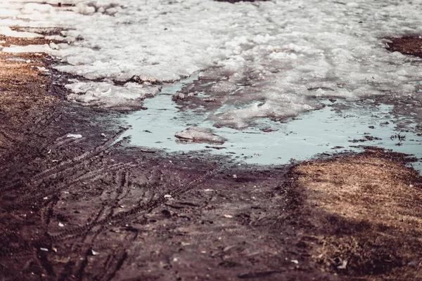 Dirty bike tracks on the ground in springtime. — Stock Photo, Image