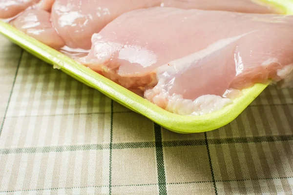 Raw Chicken Breast Fillet Lies Plastic Green Packaging Kitchen Table — Stock Photo, Image