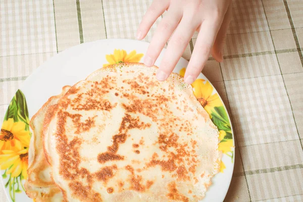 Childs Hand Reaches Fried Pancakes Take Them — Stock Photo, Image