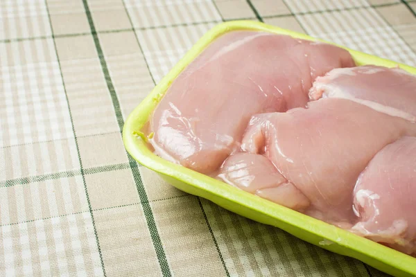 Raw Chicken Breast Fillet Lies Plastic Green Packaging Kitchen Table — Stock Photo, Image