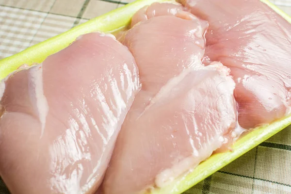 Raw Chicken Breast Fillet Lies Plastic Green Packaging Kitchen Table — Stock Photo, Image