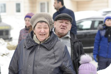 MOSCOW, RUSSIA, FEBRUARY 17, 2018: Unidentified Russian elderly people celebrate traditional festival Maslenitsa in Moscow, Russia.  Monthly pension for most retiree in Russia is 150$.