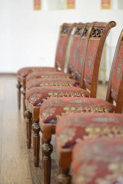 Row of chairs in a official hall.