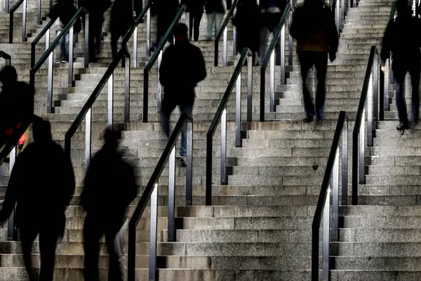 Kiev, Ukraine People descending the stairs at the Olympiiska stadium.