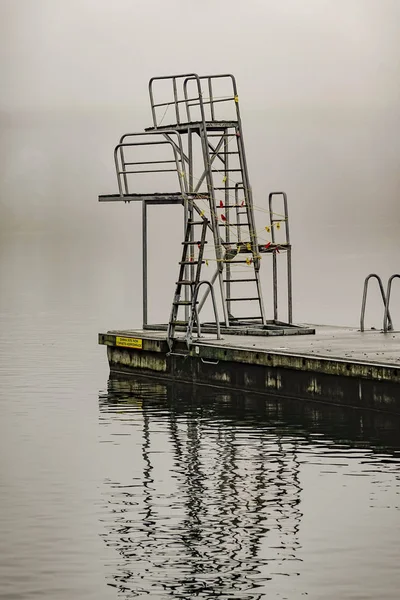Stockholm, Sweden A diving platform in the fog at Tantolunden park.