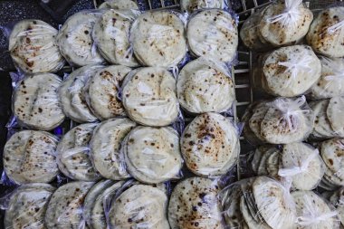 Cairo, Egypt A tray of fresh bread in bags in the busy Khan el-Khalili bazaar
