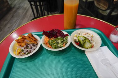 Tel Aviv, Israel Small salads on a tray at a kebab restaurant.