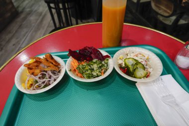 Tel Aviv, Israel Small salads on a tray at a kebab restaurant.