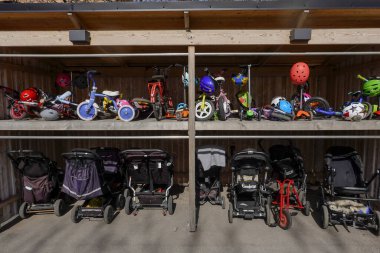 Stockholm, Sweden Children strollers parked at a daycare center. clipart