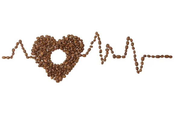 A heart made of coffee beans with a hole and a cardiogram. — Stock Photo, Image