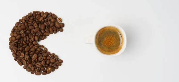 Pacman persiguiendo una taza de café caliente — Foto de Stock