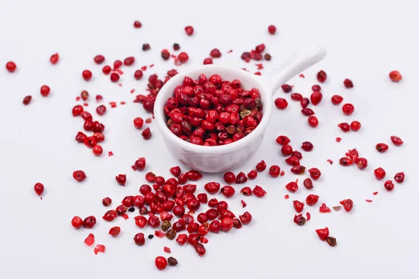 Red pepper in a small dish on a white background. Isolate