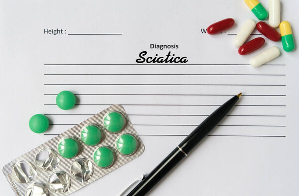 Sciatica diagnosis written on a white piece of paper. Medical concept