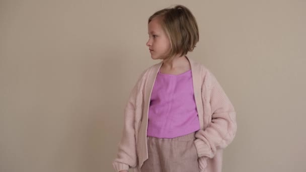 Girl Raises Her Hand Shows Thumb Beige Background — Stock Video