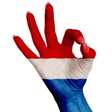 Hollanda 'nın ulusal bayrağı, işaretin tamam olduğunu gösteren bir kadın elinin üzerine boyanmıştır. Beyaz arkaplanda resim