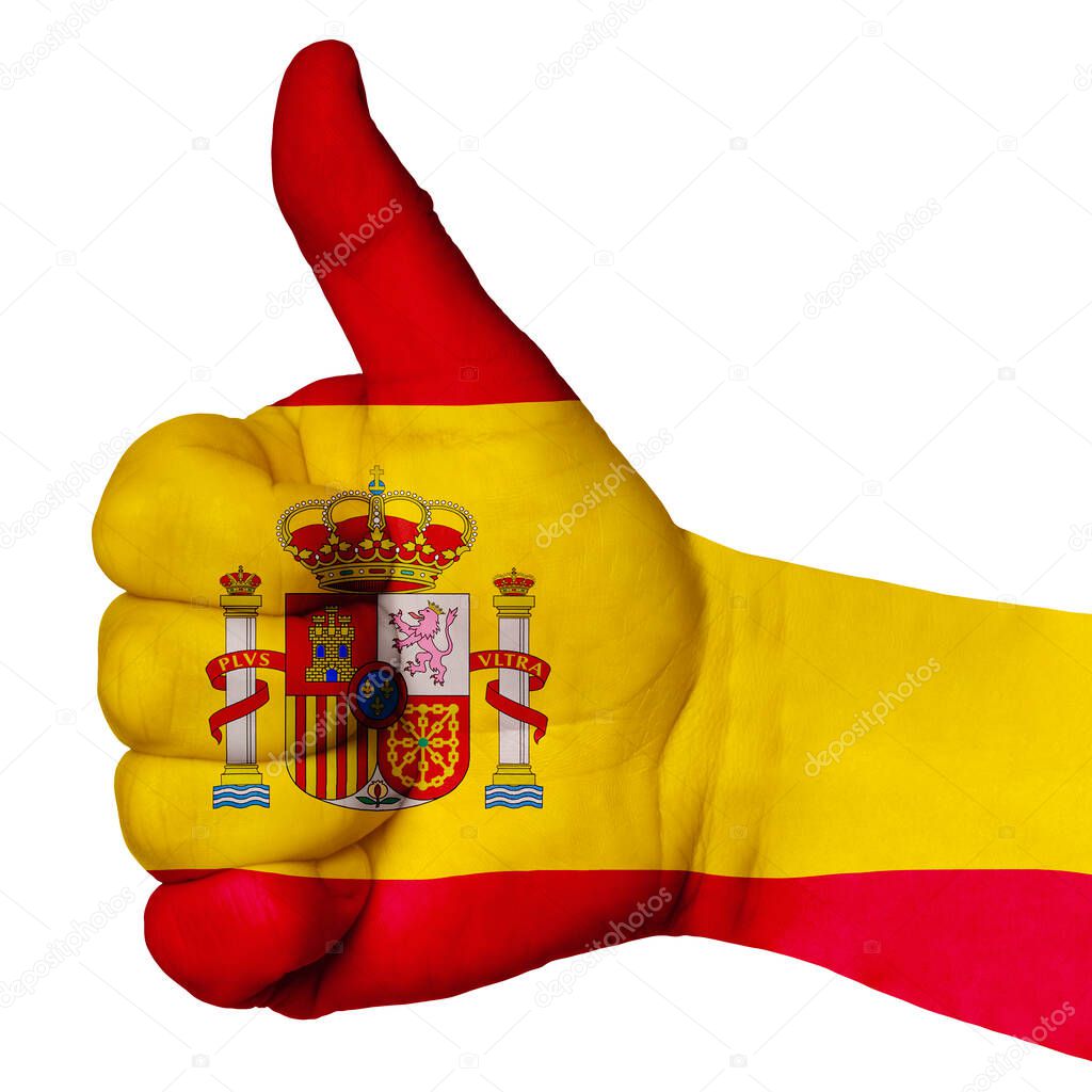 Hand with thumb up, Spain flag painted as symbol of excellence, achievement, good - isolated on white background