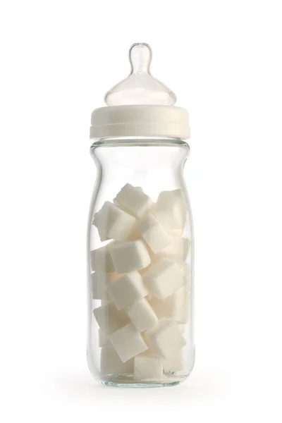 Isolated baby bottle containing sugar cubes — Stock Photo, Image