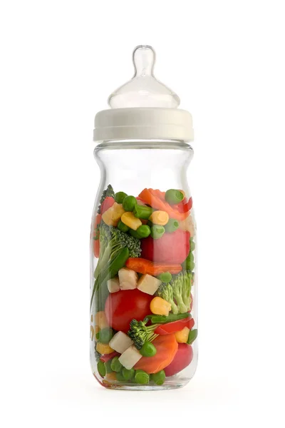 Isolated baby bottle containing vegetables — Stock Photo, Image