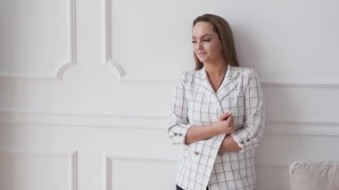 woman looking in frame in underwear and jacket flirts smiling portrait