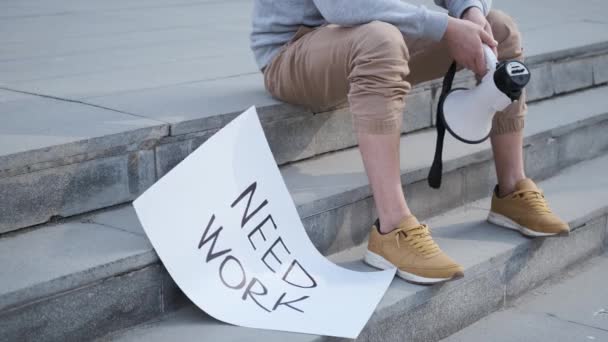 Man holding sign, need job, unemployment.Banner for job search.financial crisis — стоковое видео