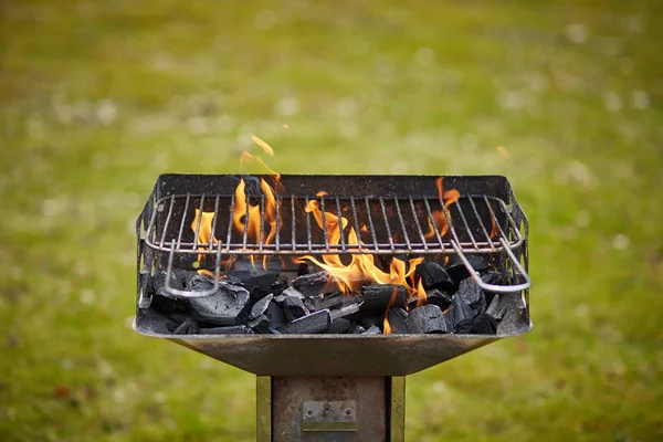 A brazier with charcoal and flame in it — Stock Photo, Image