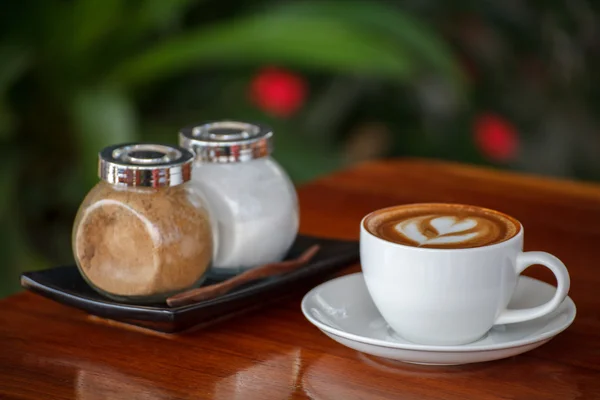 Latte art coffee on wood table — Stock Photo, Image