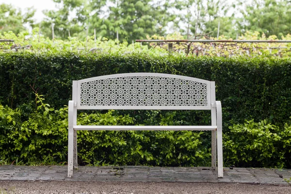 White steel bench in the park — Stock Photo, Image