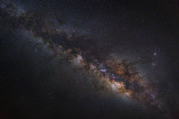 Milky way galaxy on a night sky, Long exposure photograph, with grain
