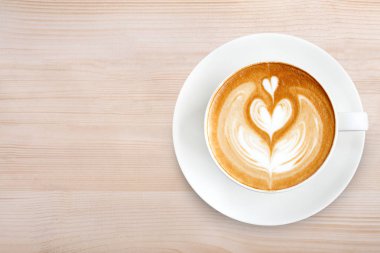 Üstten Görünüm latte sanat ahşap arka plan üzerinde kahve