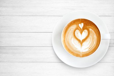 Üstten Görünüm latte sanat ahşap arka plan üzerinde kahve