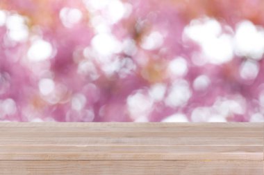 kahverengi ahşap masa üstü bokeh soyut pembe arka plan 