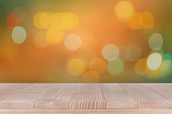 Piano in legno su sfondo arancione bokeh — Foto Stock