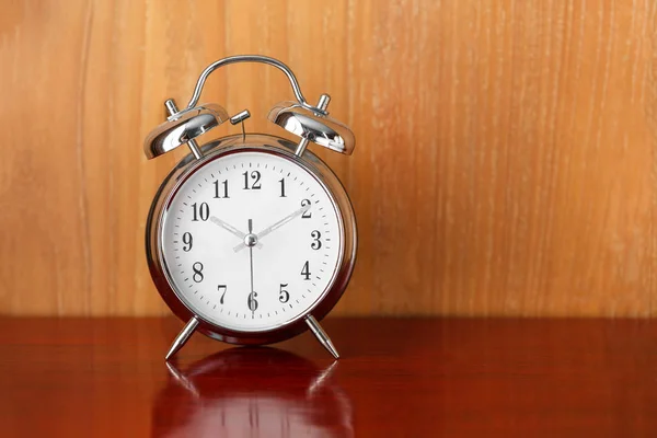 alarm table clock on wood table