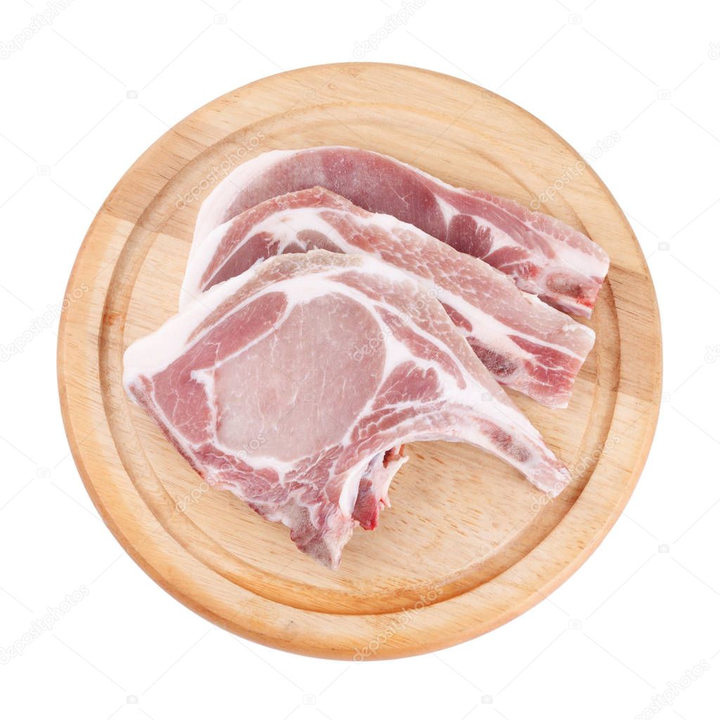 Raw pork chop on wooden broad or cooking pork chop steak 