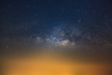 Milky way galaxy with stars and city light, Long exposure photog clipart