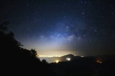 Milky Way Galaxy with light city at Doi inthanon Chiang mai, Tha clipart