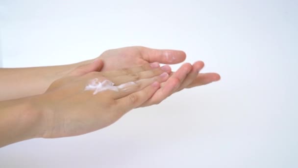 Closeup on womans hands applying moisturizing hand cream on. Cream for hands and treatment. — Stock Video