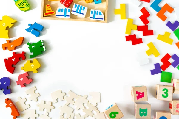 Frame from developing wooden blocks, cars and puzzles. — Stock Photo, Image