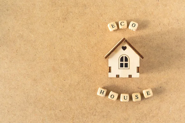 Eco friendly house - small toy model house with inscription word ECO