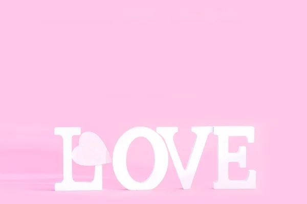 Word love from white volume letters on pink background — Stock Photo, Image