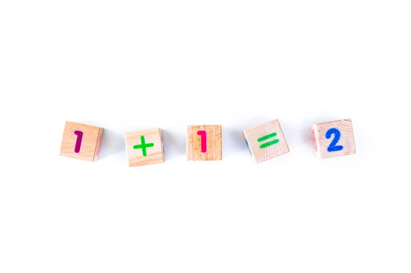 Kids toys wooden cubs with letters and numbers on white background Stock Image