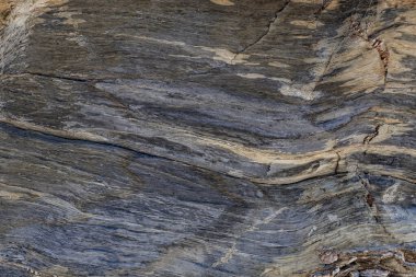 Kaya yüzeyinin doğal dokusu zamanla çizilen çizgileri görebilirsiniz. Arkaplan olarak kullanılabilir.