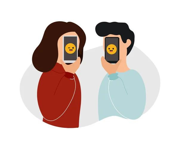 Couple tenant des téléphones avec des émoticônes devant eux — Image vectorielle