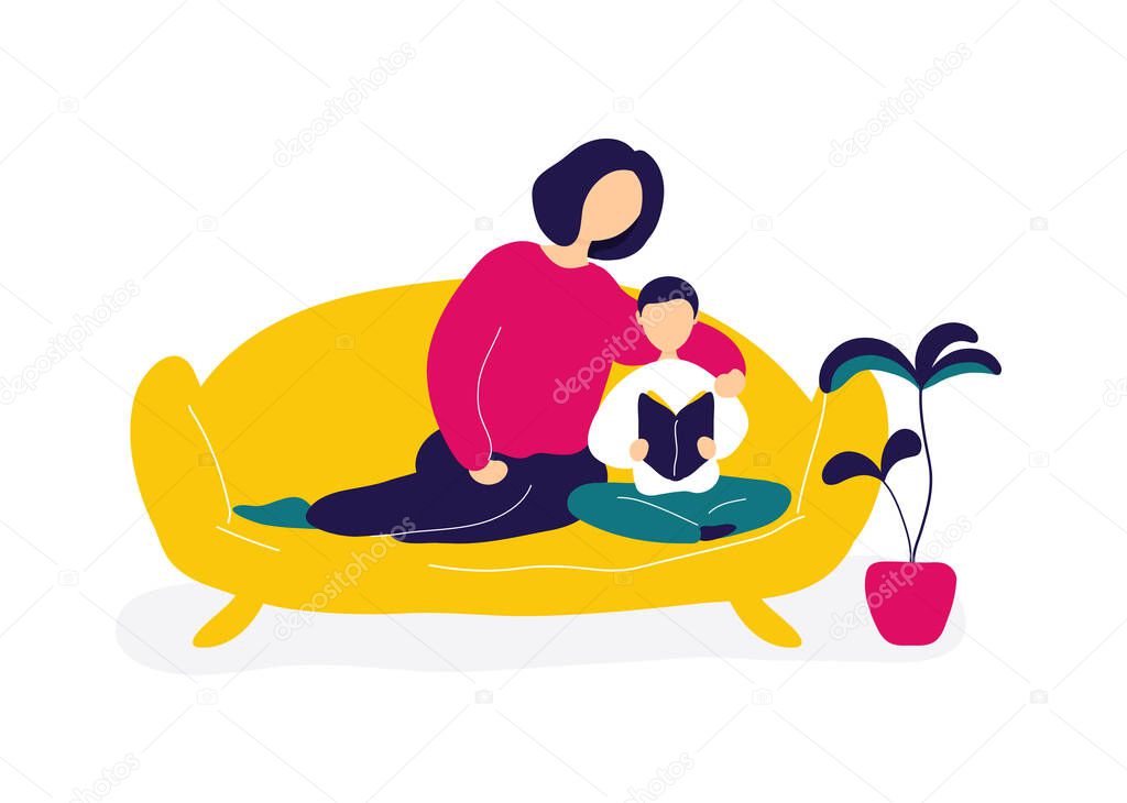 Mother reading book with son on sofa
