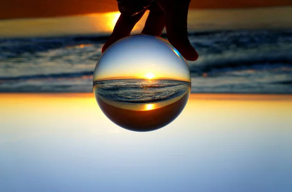 Beautiful sunrise captured through a lens ball at Fort Lauderdale Beach, Florida, U.S.A — 스톡 사진