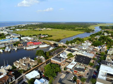 Lewes, Delaware, U.S.A - June 2, 2019 - The aerial view of the beach town, fishing port and waterfront residential homes along the canal clipart
