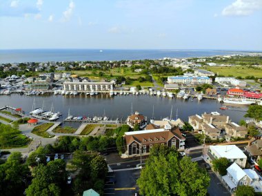 Lewes, Delaware, U.S.A - June 2, 2019 - The aerial view of the beach town, fishing port and waterfront residential homes along the canal clipart