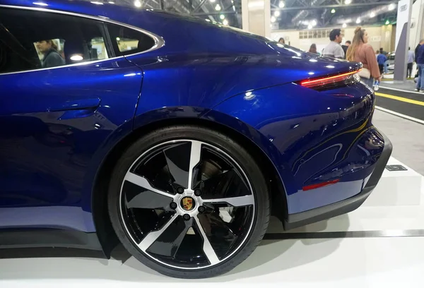 Philadelphia, Pennsylvania, U.S.A - February 9, 2020 - The side view of a blue metallic 2020 Porsche Taycan 4S all electric sports sedan — ストック写真