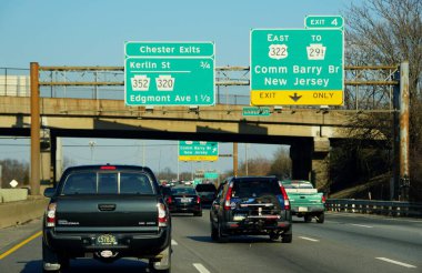 Chester, Pennsylvania, U.S.A - February 9, 2020 - Highway signs on Interstate 95, Route 322 and Route 291 for Commodore Barry Bridge exit